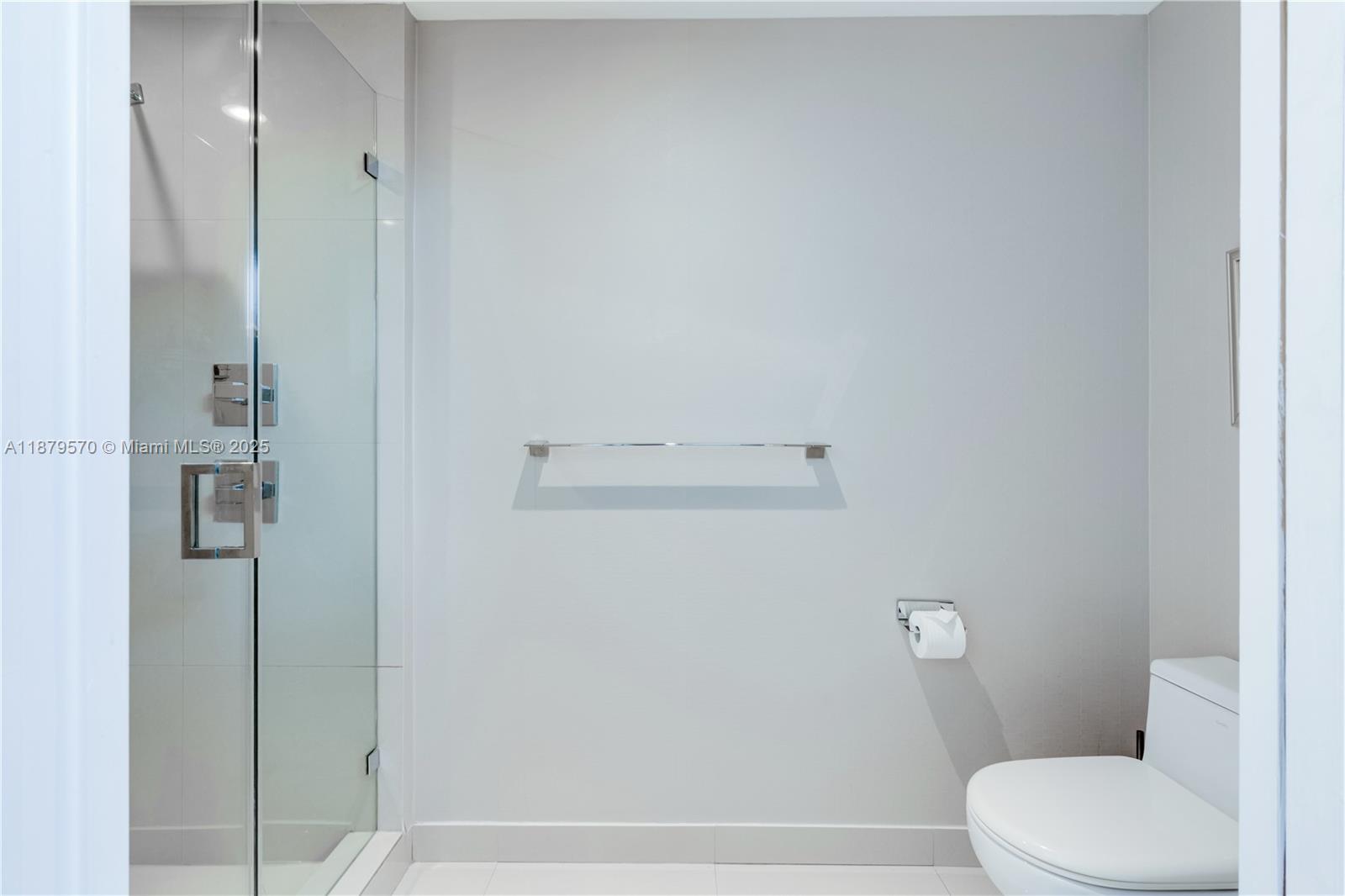 600 Northeast 27th Street, Unit 2801 Miami, FL 33137 - Photo 34 of 48 a bathroom with a toilet and a shower