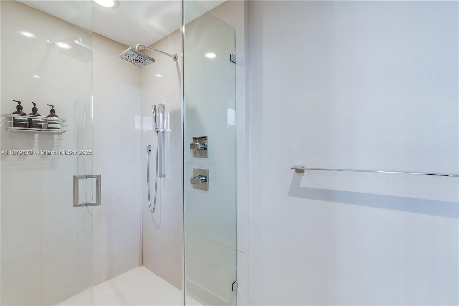 600 Northeast 27th Street, Unit 2801 Miami, FL 33137 - Photo 35 of 48 a bathroom with a shower and a glass door