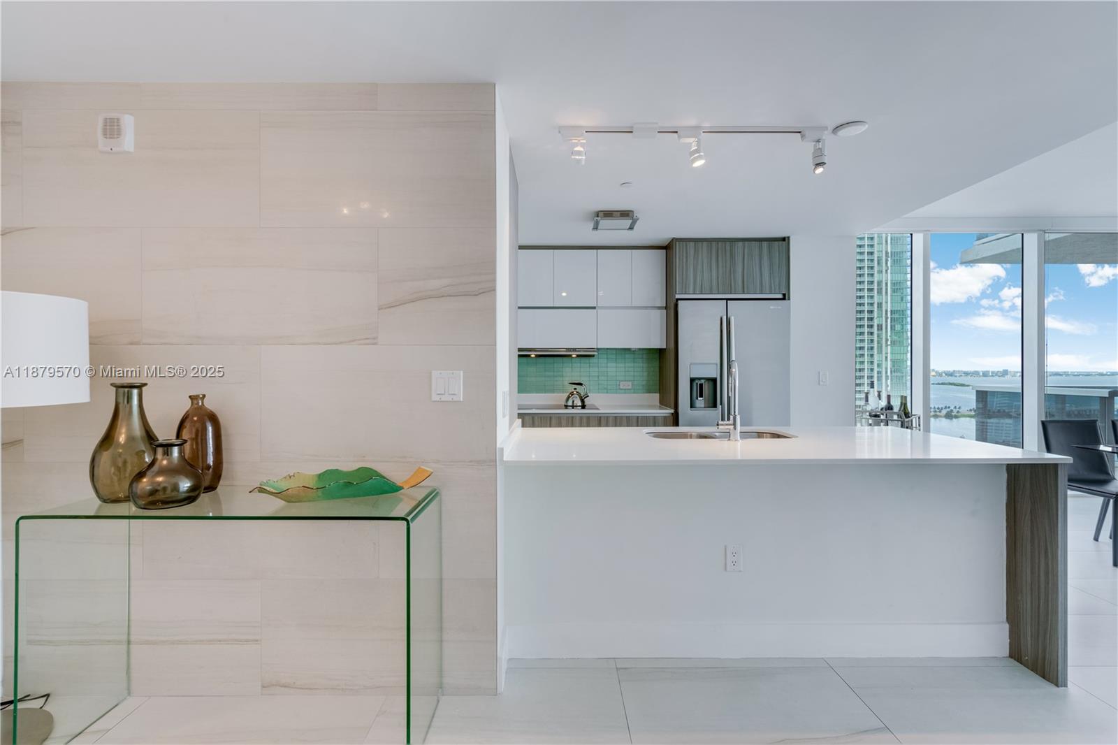 600 Northeast 27th Street, Unit 2801 Miami, FL 33137 - Photo 4 of 48 a kitchen with stainless steel appliances granite countertop a sink and cabinets