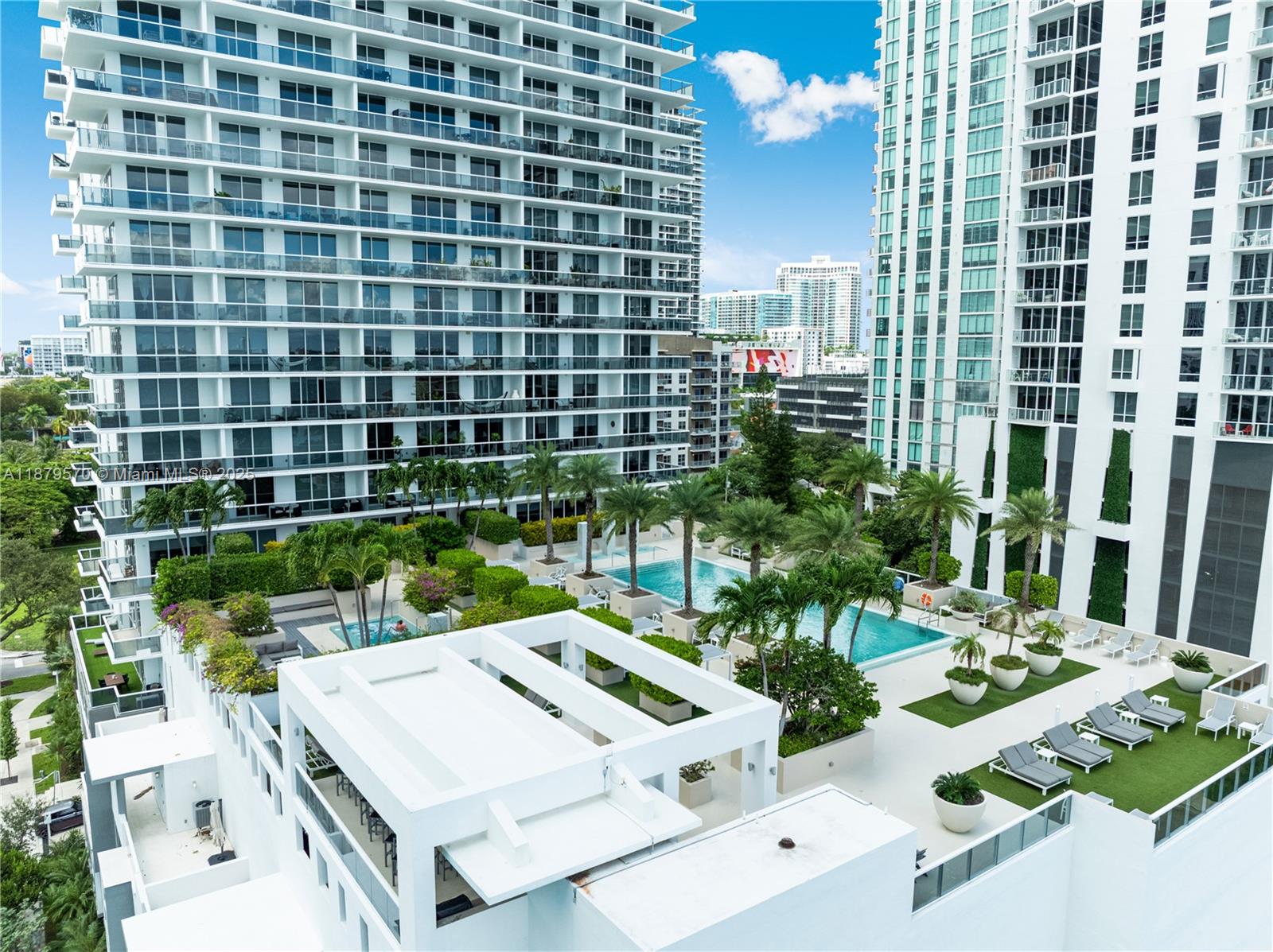 600 Northeast 27th Street, Unit 2801 Miami, FL 33137 - Photo 42 of 48 a view of a patio with table and chairs and potted plants