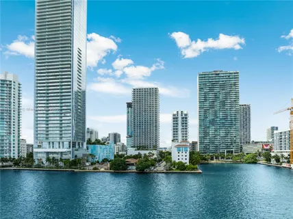 a view of a city with tall trees