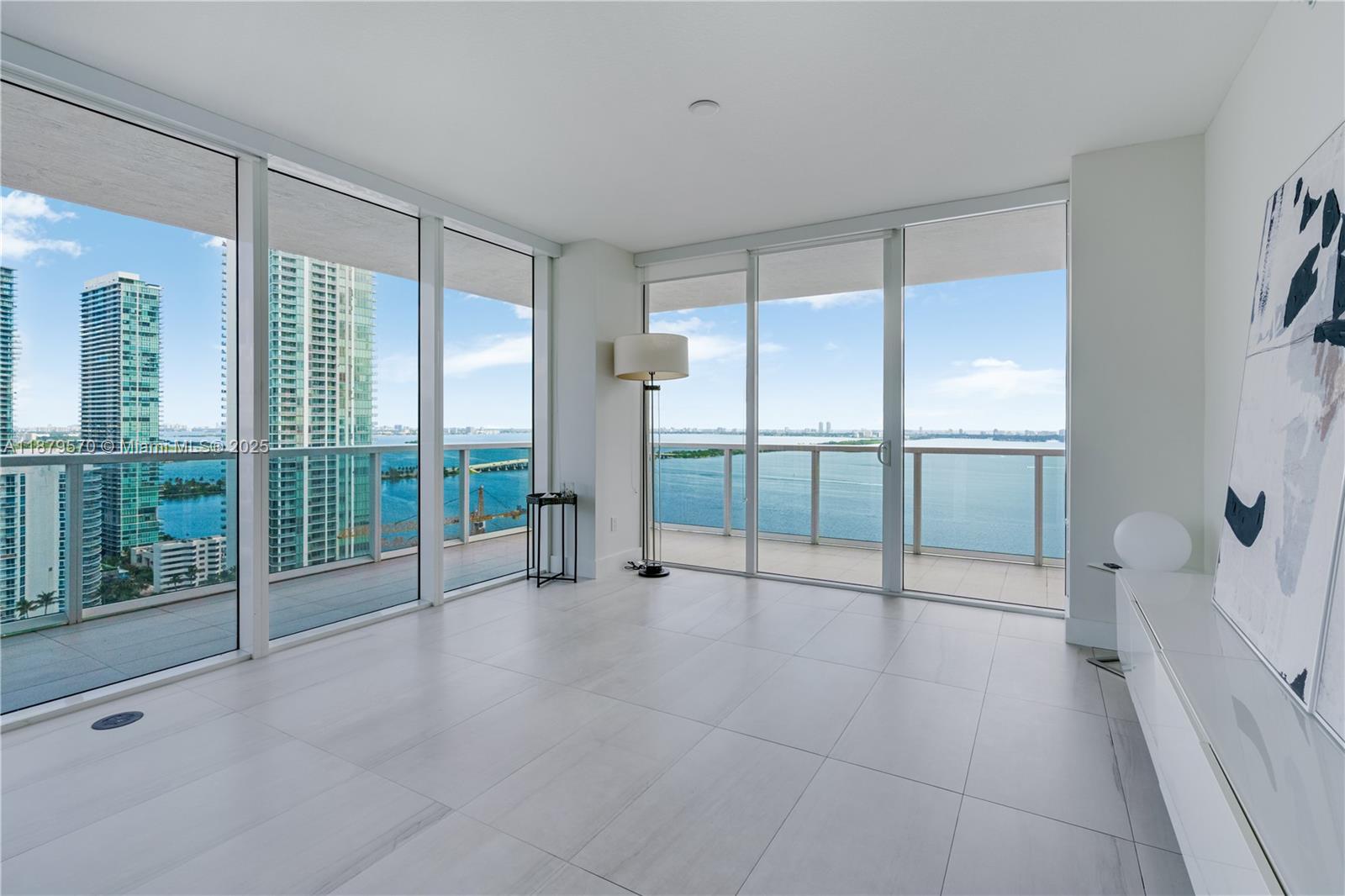 600 Northeast 27th Street, Unit 2801 Miami, FL 33137 - Photo 9 of 48 an empty room with sliding glass door and mountain view