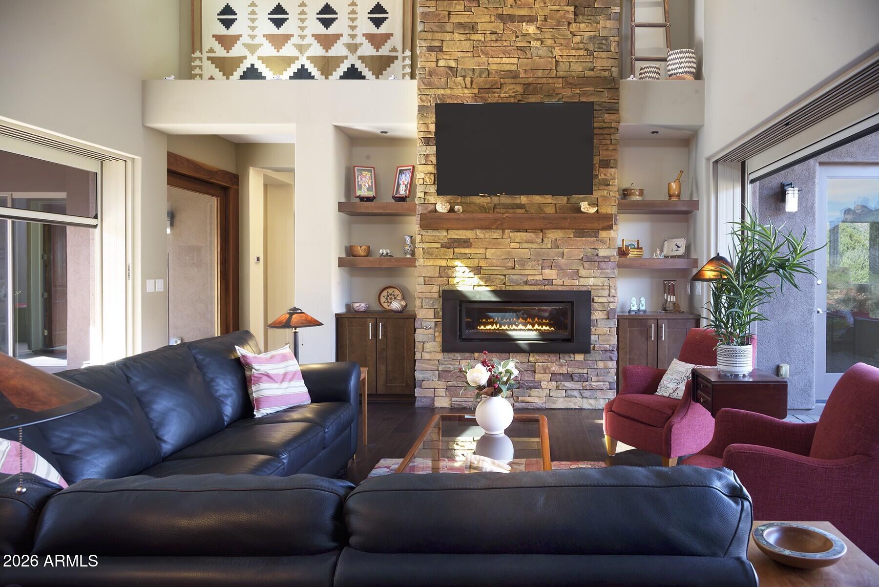 25 Cathedral Ranch Drive Sedona, AZ 86351 - Photo 11 of 40 a living room with furniture and a fireplace