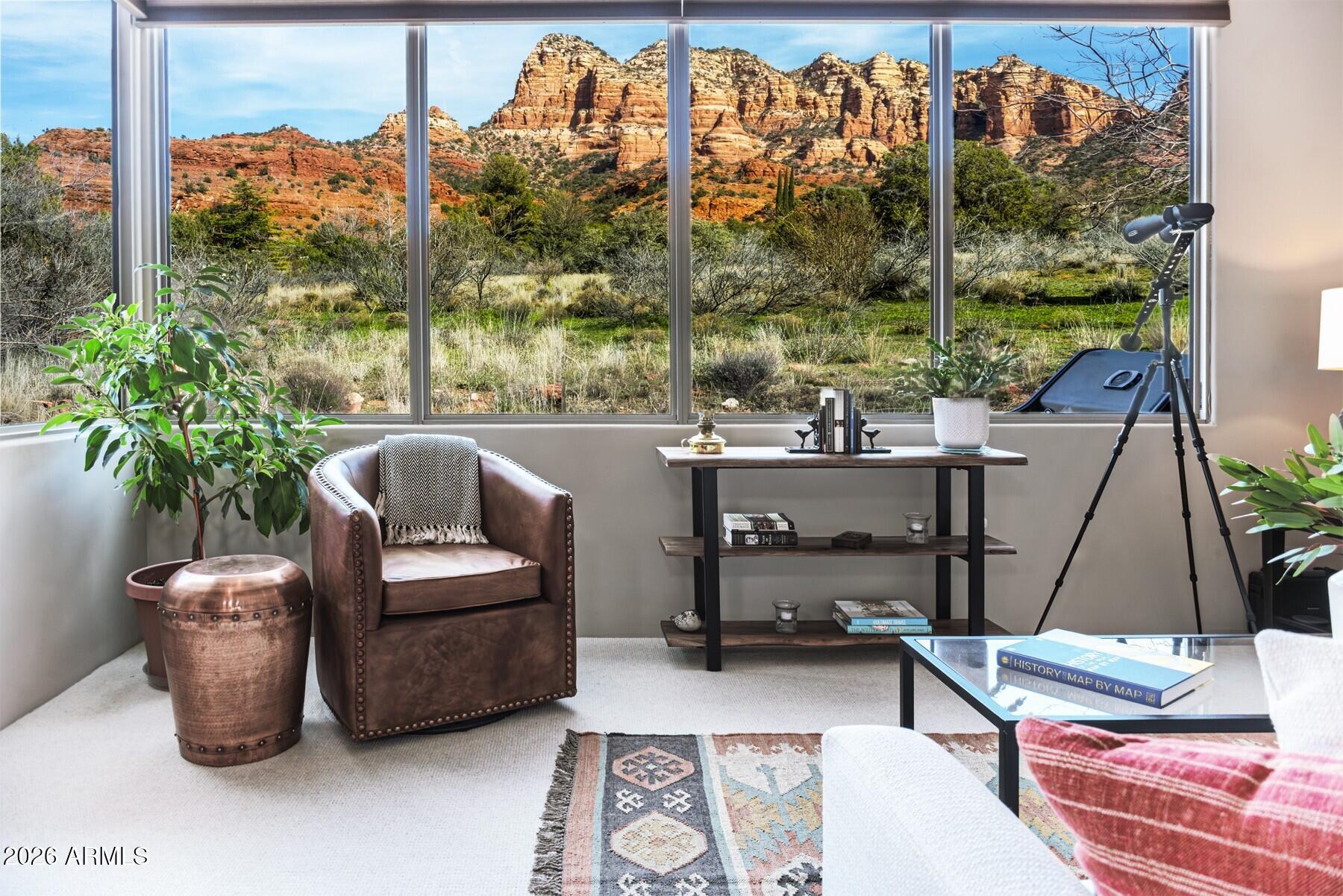 25 Cathedral Ranch Drive Sedona, AZ 86351 - Photo 20 of 40 a living room with furniture and a floor to ceiling window