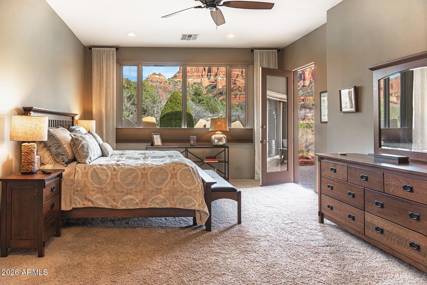 25 Cathedral Ranch Drive Sedona, AZ 86351 - Photo 22 of 40 a bed room with a bed and a dresser