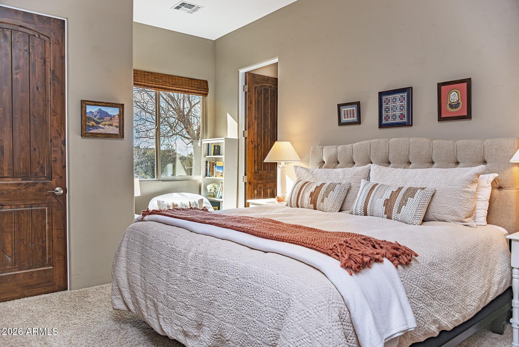 25 Cathedral Ranch Drive Sedona, AZ 86351 - Photo 24 of 40 a bed sitting in a bedroom next to a window