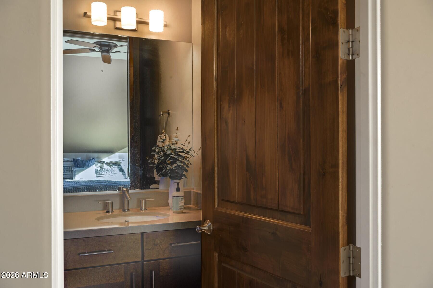 25 Cathedral Ranch Drive Sedona, AZ 86351 - Photo 27 of 40 a bathroom with a sink a mirror and a window
