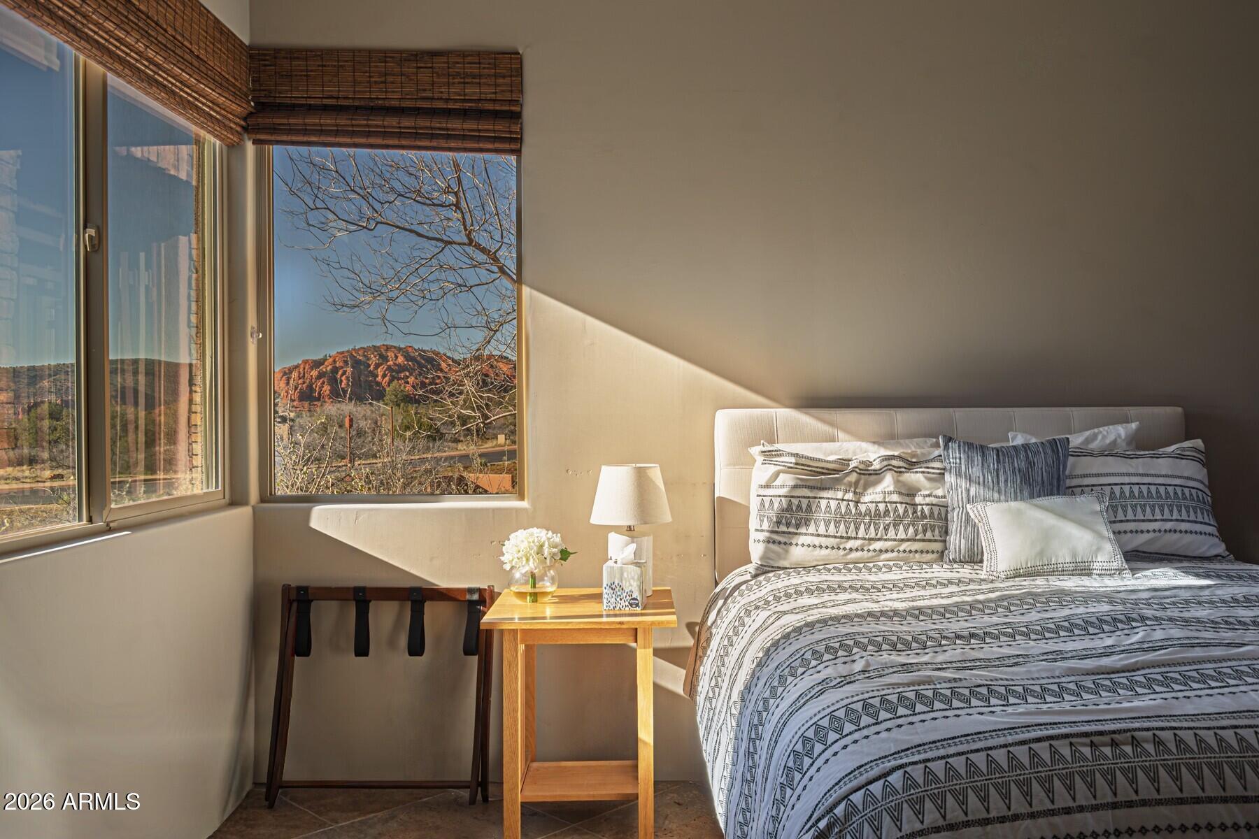 25 Cathedral Ranch Drive Sedona, AZ 86351 - Photo 28 of 40 a bedroom with bed and a window