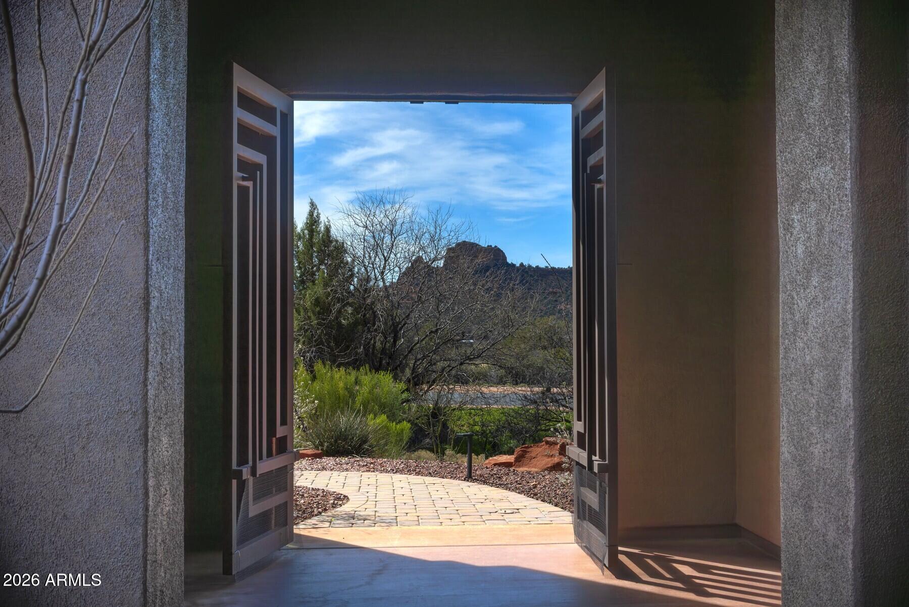 25 Cathedral Ranch Drive Sedona, AZ 86351 - Photo 5 of 40 a view of a room with a large window and wooden floor