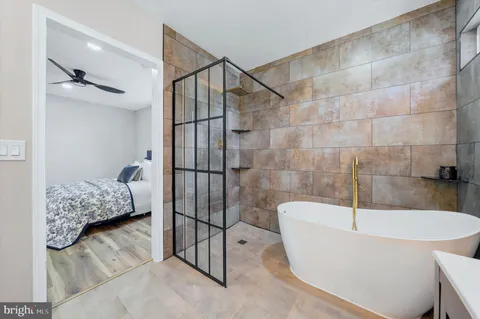 a view of walk in closet with window and couch