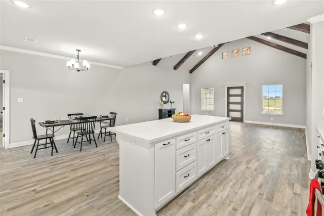 a front view of a house with a large window