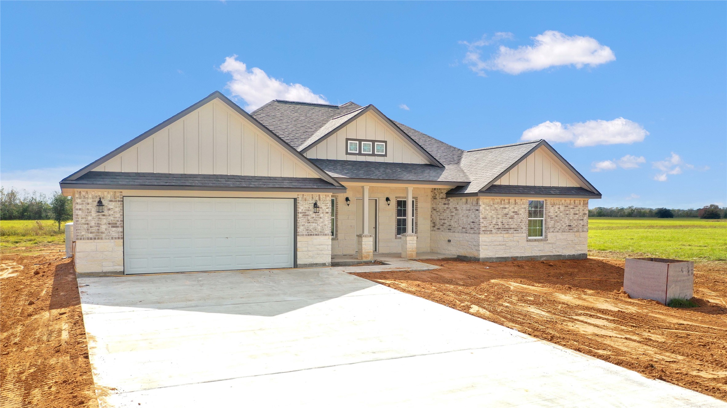 537 Chuckwagon Trail Angleton, TX 77515 - Photo 18 of 19 a front view of a house with a yard and garage