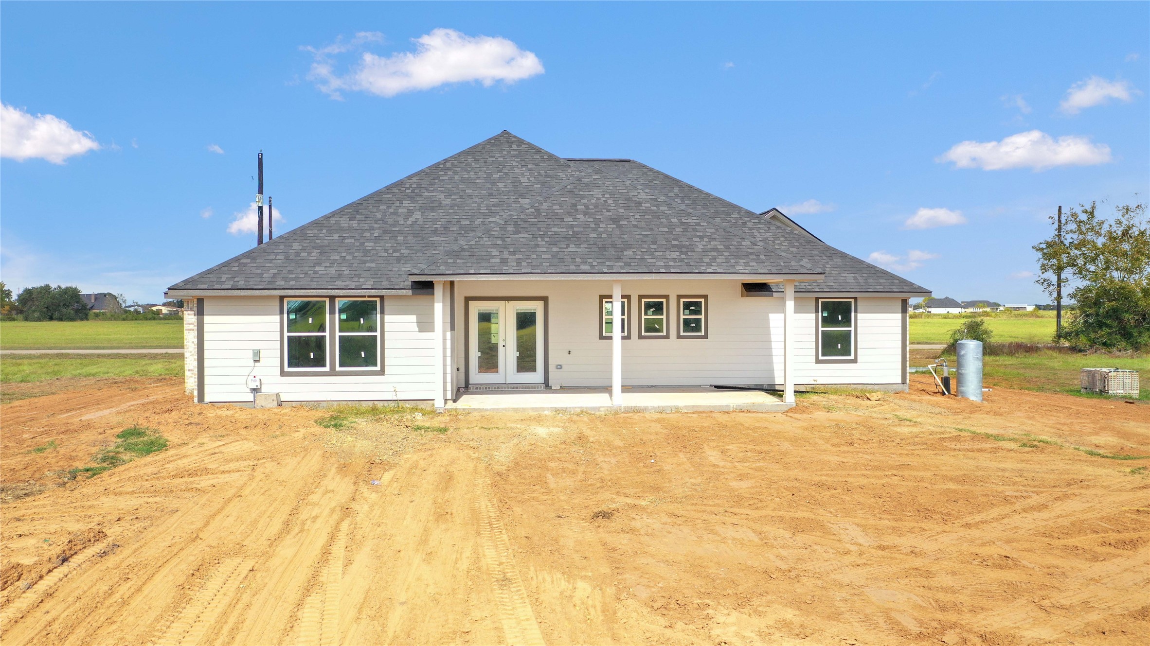 537 Chuckwagon Trail Angleton, TX 77515 - Photo 3 of 19 a front view of a house with a garden