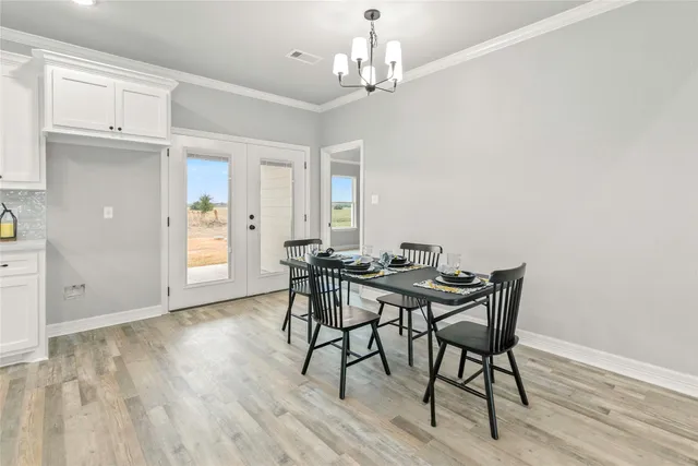an empty room with a ceiling fan and a window