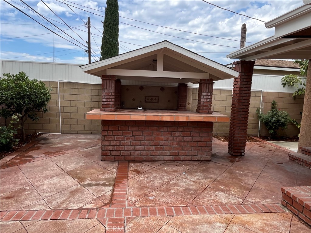 1326 East 15th Street Santa Ana, CA 92701 - Photo 5 of 21 a front view of a house with a garage