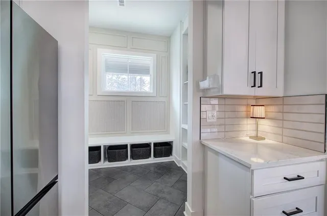 a view of wooden floor and windows in a room