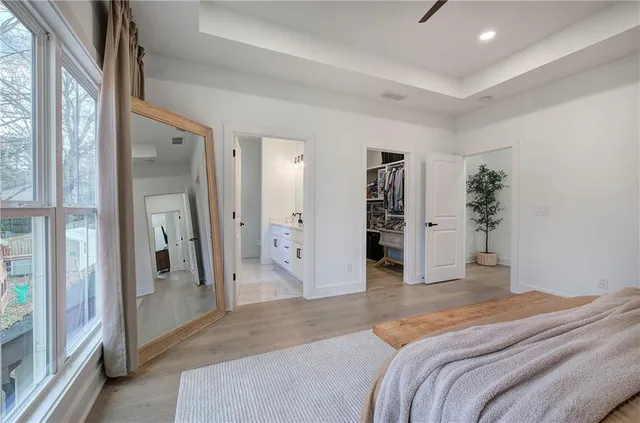 a room with a bed and a view of bedroom