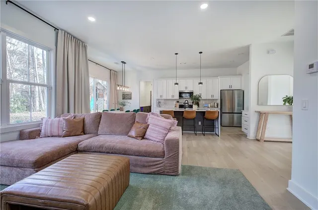 a kitchen with sink and refrigerator