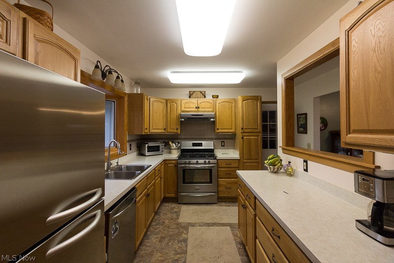 5830 Beach Road Wadsworth, OH 44281 - Photo 19 of 32 Kitchen boasts stainless steel appliances and updated cabinets and counters.