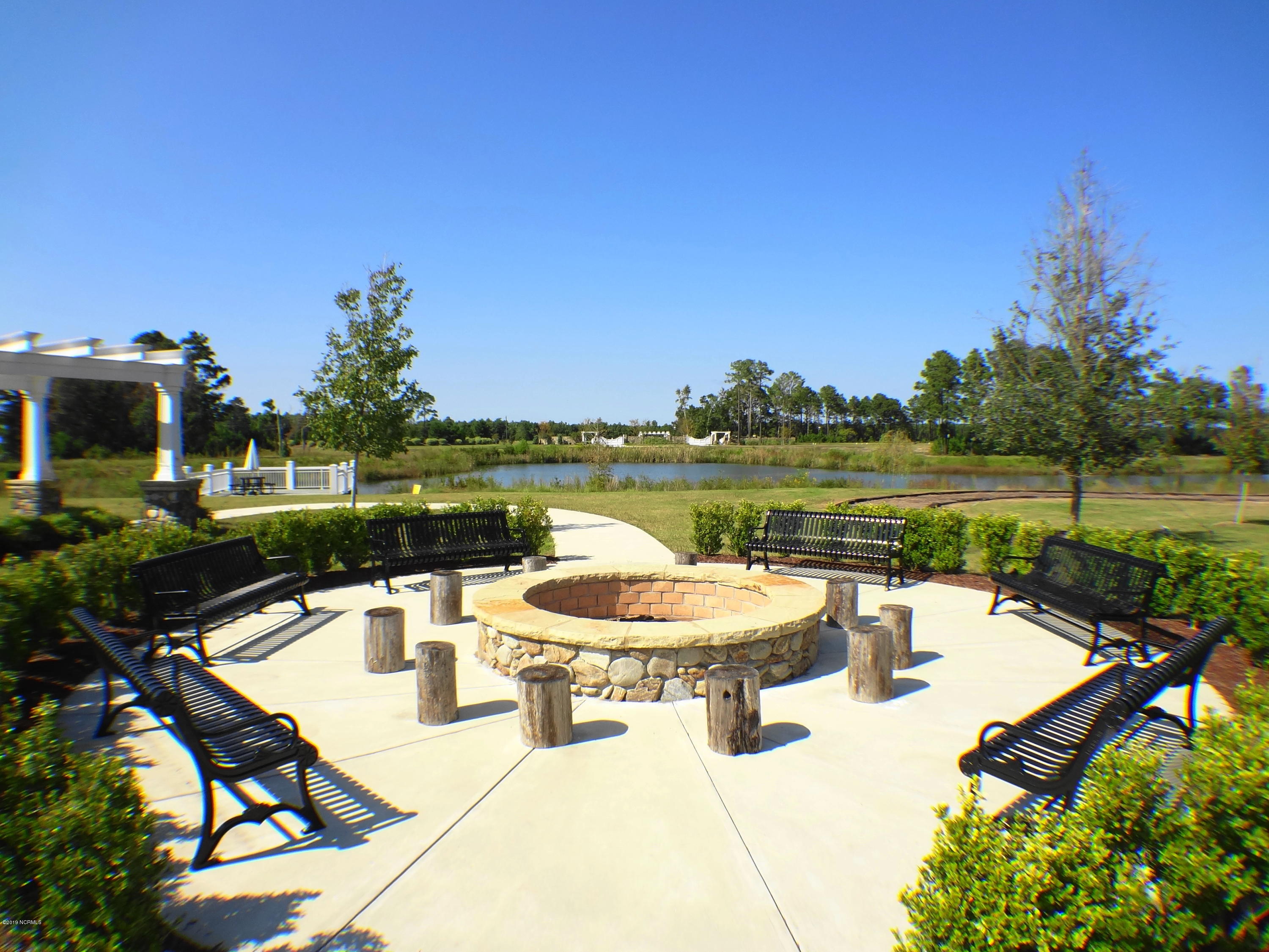 611 Tom Nevers Way Holly Ridge, NC 28445 - Photo 54 of 56 Firepit and Sitting Area