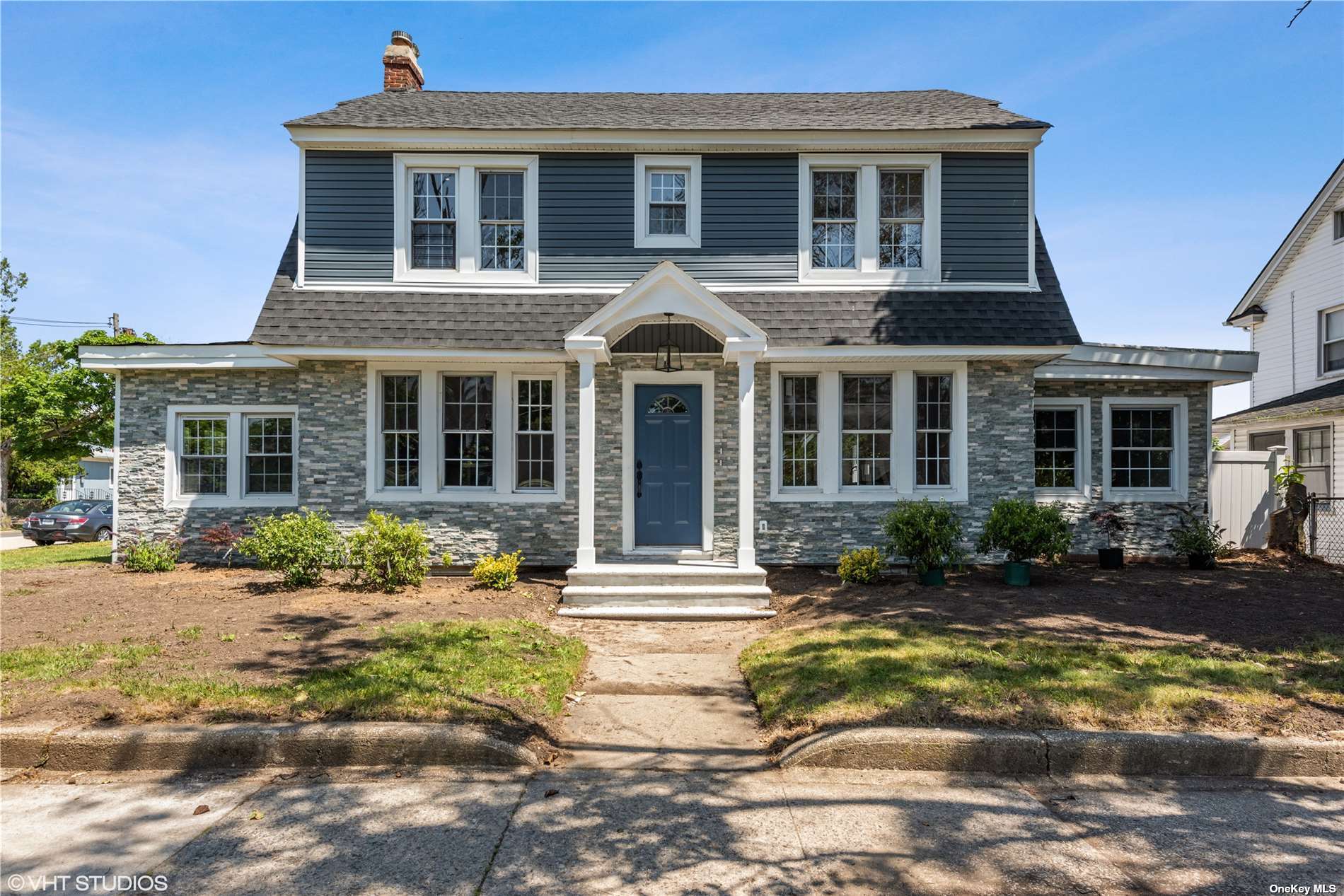 393 Merrick Road Rockville Centre, NY 11570 - Photo 1 of 1 a front view of a house