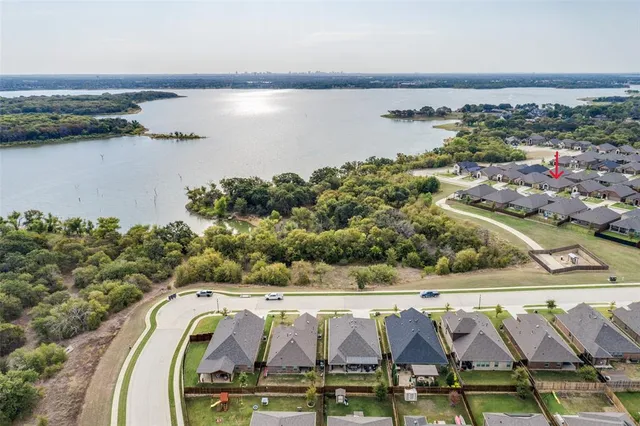 a view of a house with a swimming pool and a yard