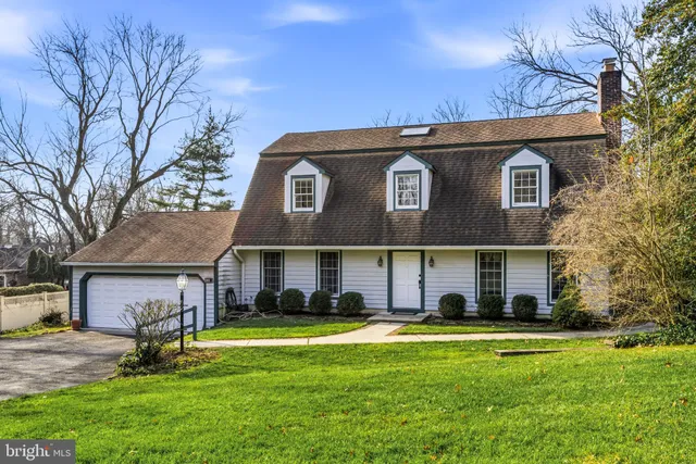 a view of a brick house with potted plants