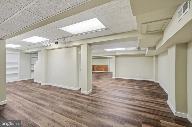 a kitchen with stainless steel appliances granite countertop a stove and a refrigerator