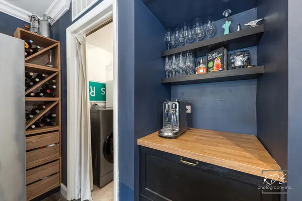 a kitchen with a refrigerator and a stove