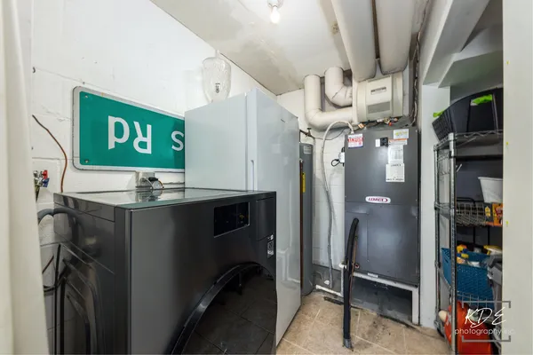 a kitchen with refrigerator and cabinets