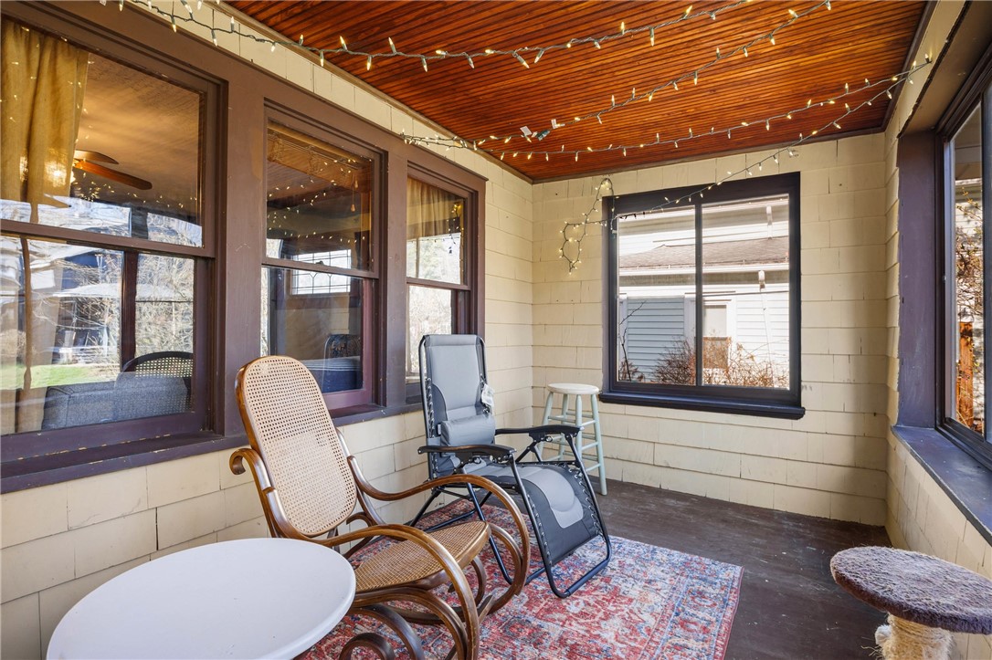 69 Benton Street Rochester, NY 14620 - Photo 4 of 23 Enclosed porch...wonderful for morning coffee!
