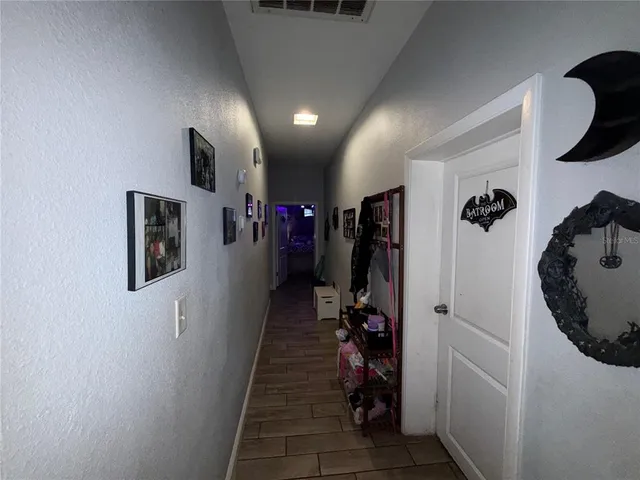 a view of a livingroom with furniture and closet