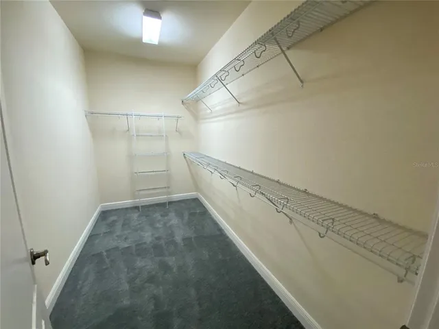 a view of a room with racks on the wall