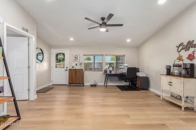 a living room with furniture and white walls