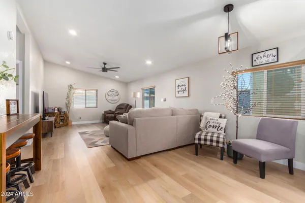a living room with furniture and a window