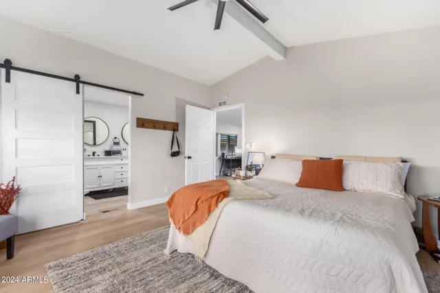 a bedroom with a bed and a walk in closet