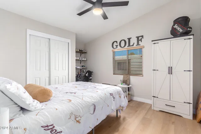 a bedroom with a bed and a window