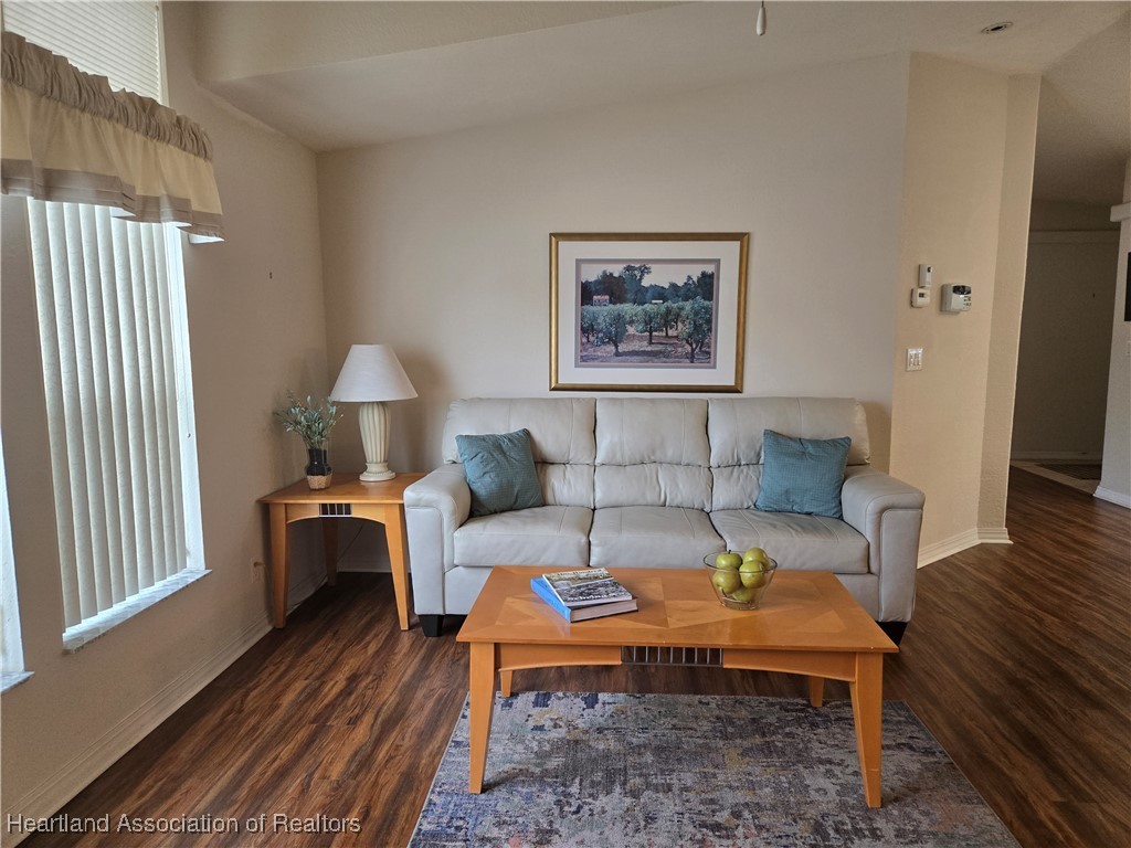 3312 Beartooth Pass Sebring, FL 33872 - Photo 13 of 39 a living room with furniture and a window