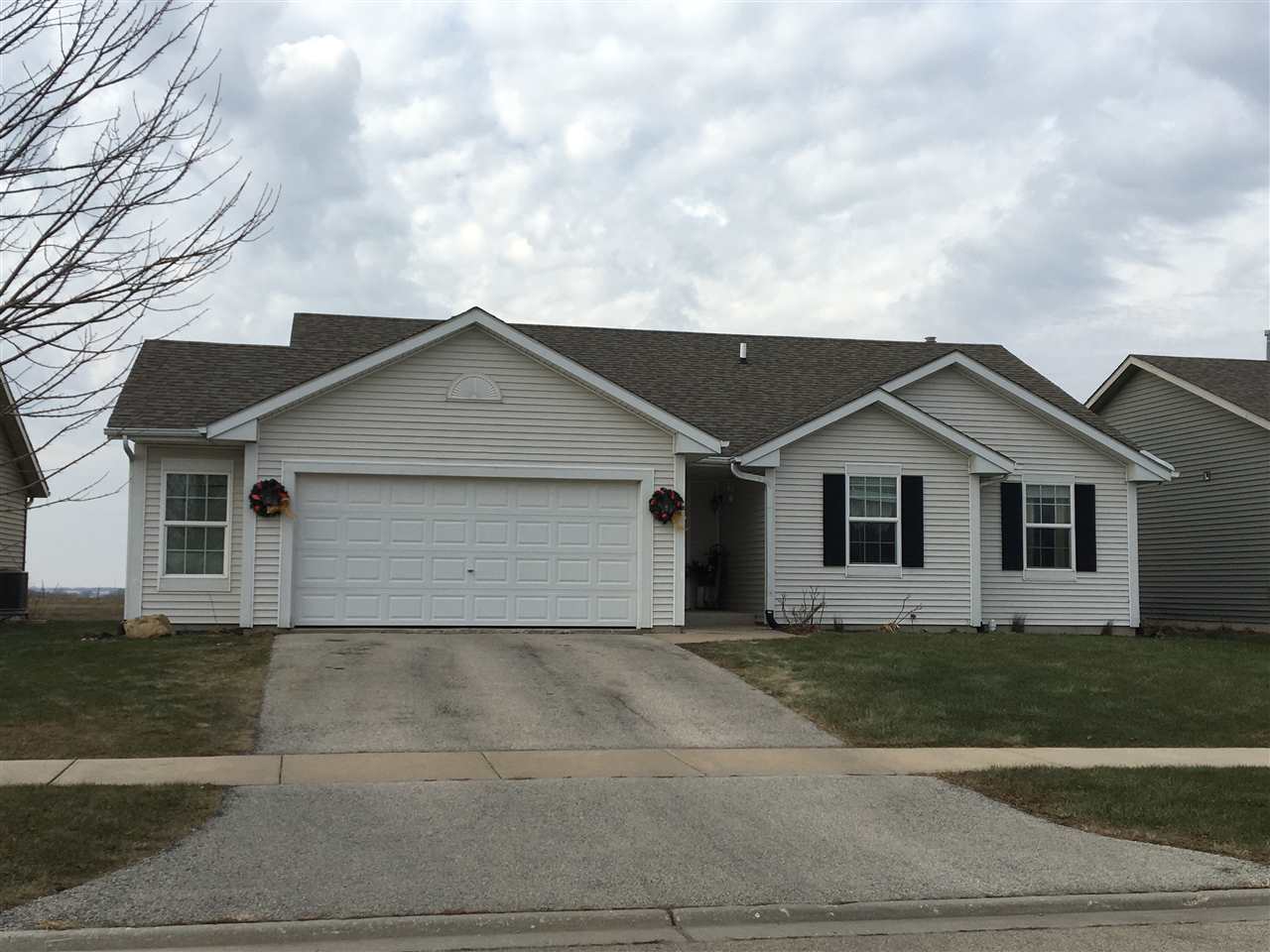 503 South Regulators Street Rochelle, IL 61068 - Photo 1 of 14 a view of house with a yard and garage