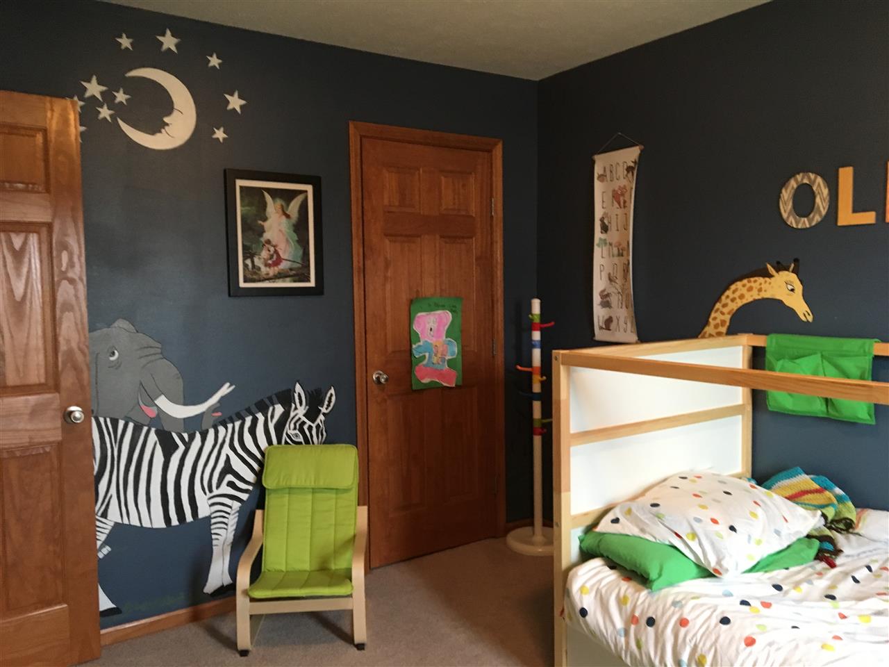 503 South Regulators Street Rochelle, IL 61068 - Photo 11 of 14 a bedroom with a bed and a window