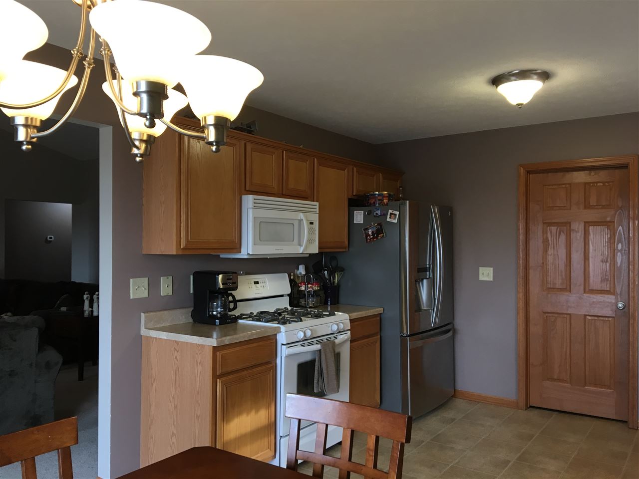503 South Regulators Street Rochelle, IL 61068 - Photo 5 of 14 a kitchen that has a refrigerator a stove and a sink