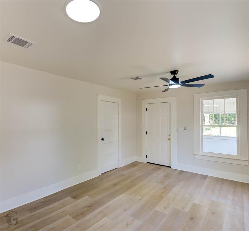 510 Constable Street Minden, LA 71055 - Photo 5 of 18 an empty room with a window and a fan