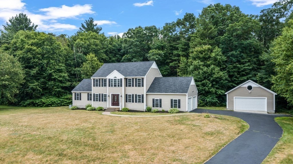 a house that has a tree in front of it