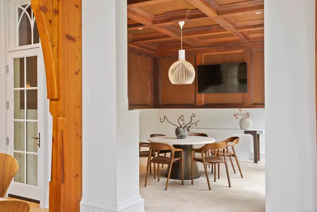 a dining room with a table and chairs
