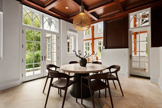 a view of a dining room with furniture window and outside view