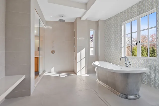 a spacious bathroom with a bathtub and sink