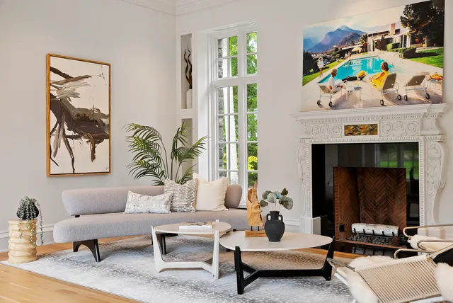 a living room with furniture and a fireplace