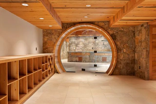 a view of an empty room with a fireplace