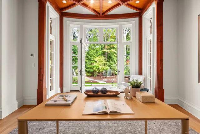 a living room with furniture and large window