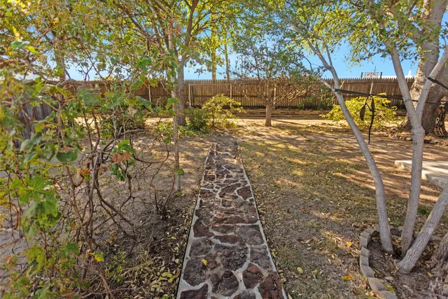 a view of a swimming pool with a yard